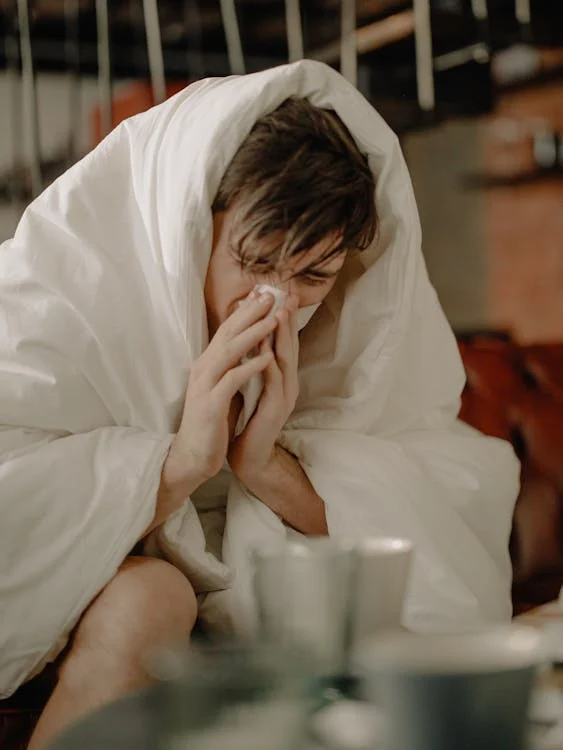 A man sick with the flu.