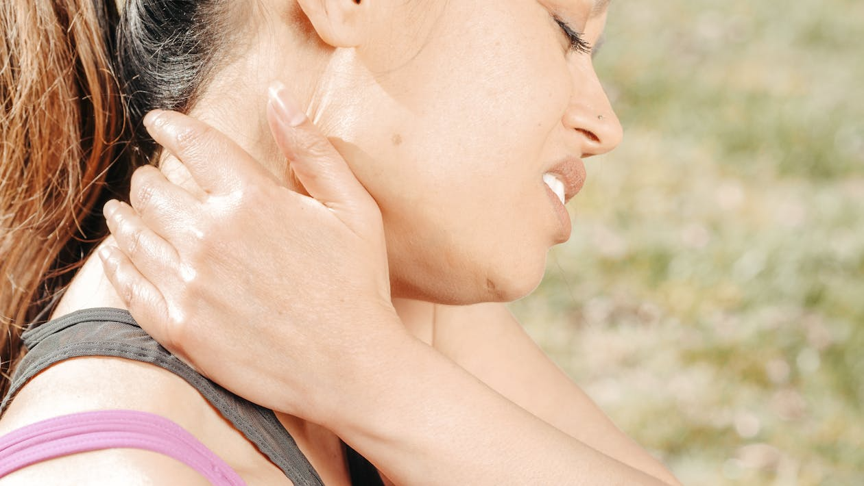 A woman experiences body pain.