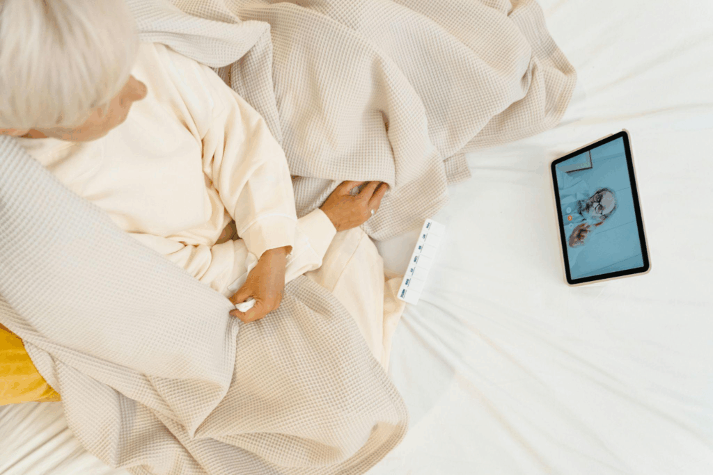 a sick person consulting with a doctor online