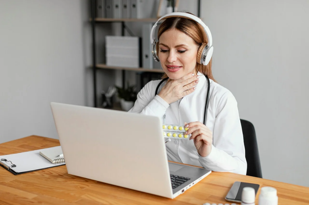 The doctor is prescribing medicines to the patient via a laptop