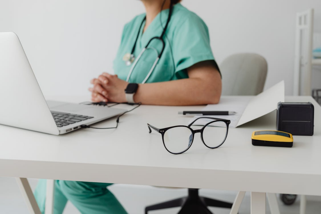doctor comforting a patient during an online consultation.