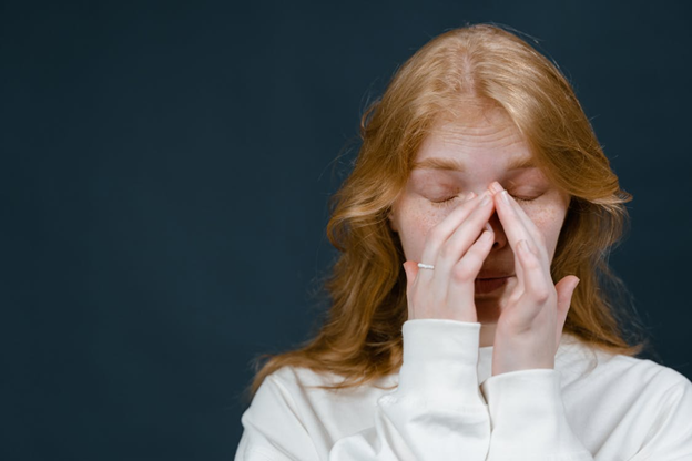 a woman experiencing sinus pressure