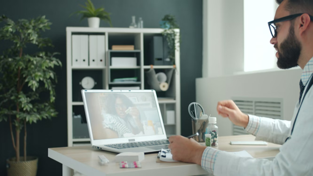 a doctor consulting a patient over a video call online