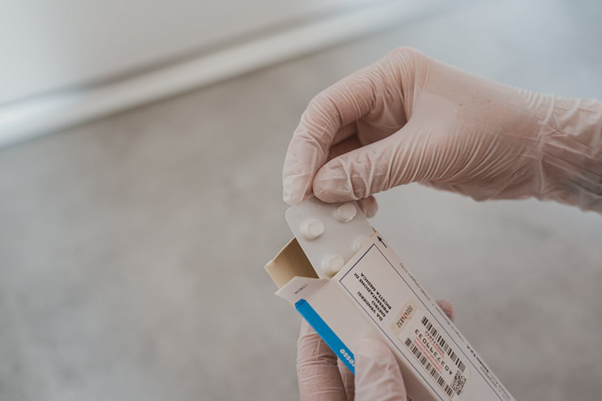 Person holding a box of cold or flu medication