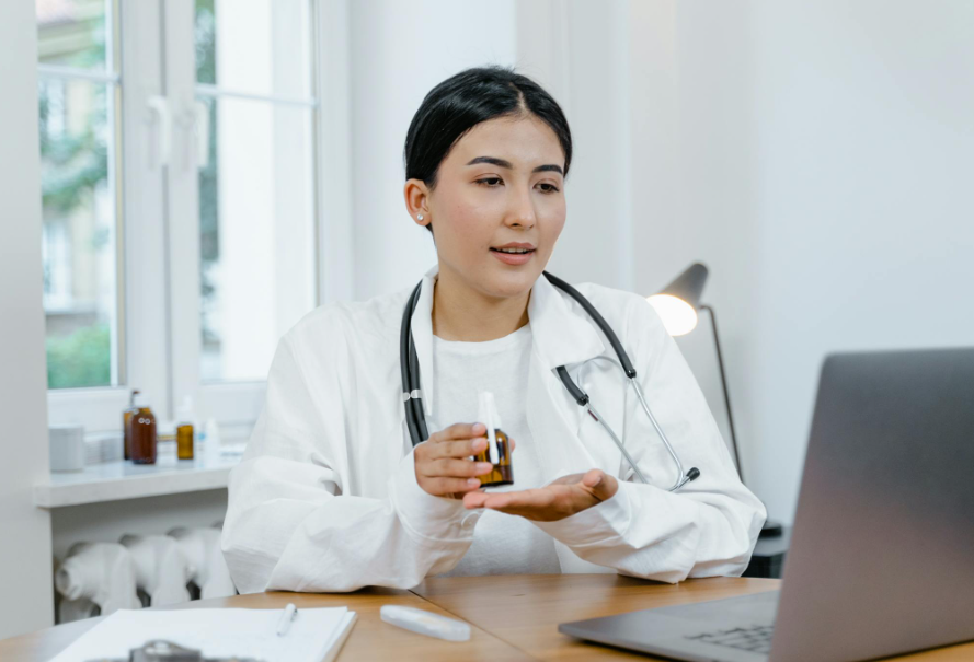 This image shows a doctor conducting an online session with a patient.