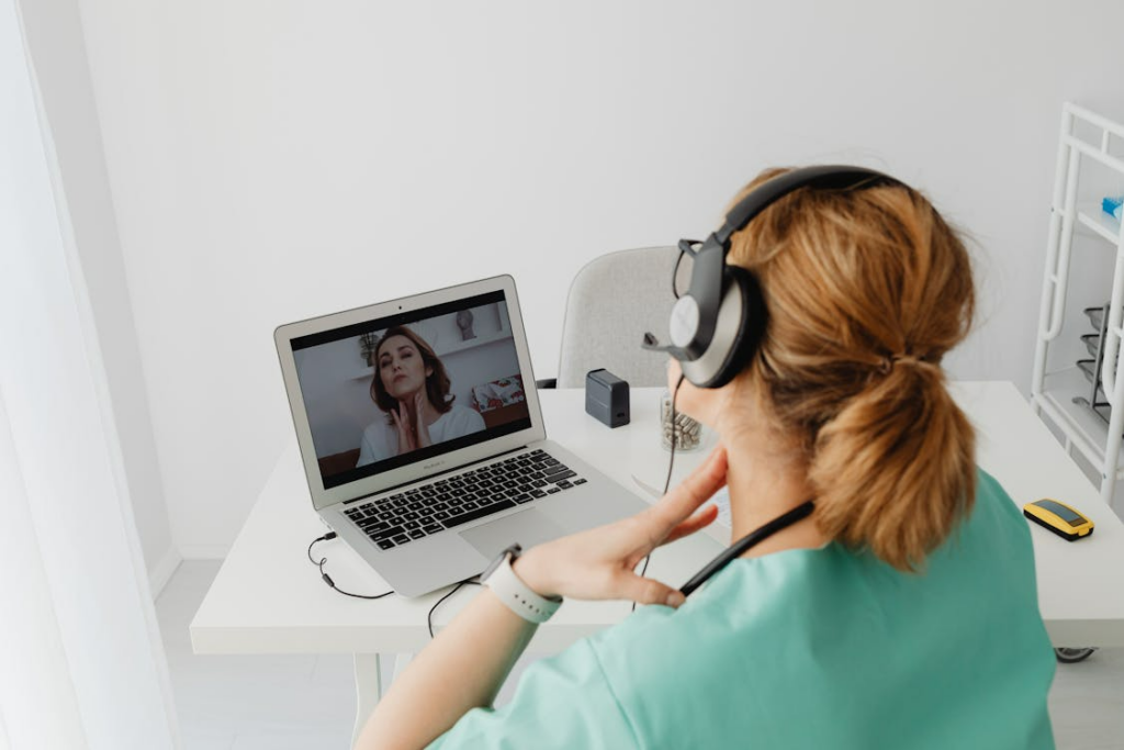 Patient showing throat symptoms during a virtual doctor appointment