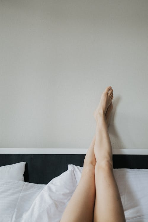 person elevating legs to reduce swelling