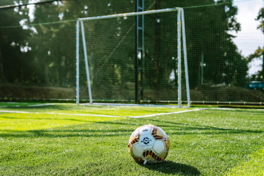 A small football placed on the ground. 
