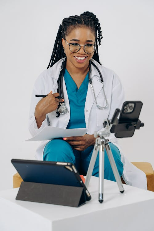 Patient using laptop for a virtual gynecologist appointment