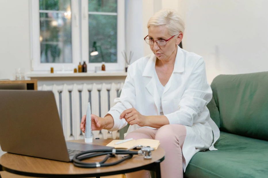 This image shows a female doctor giving online consultation.